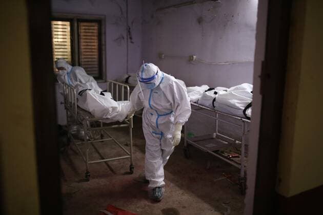 (210512) -- KATHMANDU, May 12, 2021 -- Health workers pull a stretcher carrying the dead body of a COVID-19 victim at a hospital in Kathmandu, Nepal, on May 12, 2021. (Photo by Xinhua) NEPAL-KATHMANDU-COVID-19-DEATH SulavxShrestha 