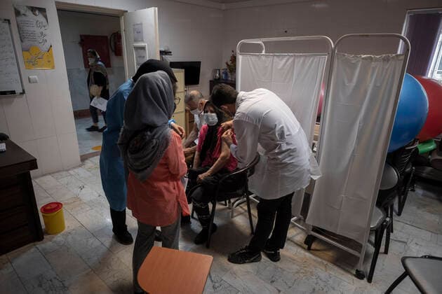 Vaccination Of People Over 80 Years By The AstraZeneca And Sinopharm COVID-19 Vaccines In Tehran An Iranian elderly woman wearing a protective face mask receives a dose of the China s Sinopharm new coronavirus disease (COVID-19) vaccine, at the west Tehran health center on May 11, 2021. Tehran Tehran Iran nikoubazl-vaccinat210511_np8LD  Copyright: xMortezaxNikoubazlx