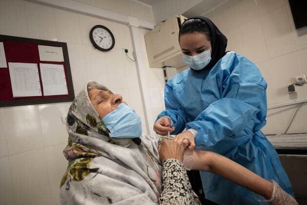 Vaccination Of People Over 80 Years By The AstraZeneca And Sinopharm COVID-19 Vaccines In Tehran An Iranian elderly woman wearing a protective face mask reacts as she receives a dose of the China s Sinopharm new coronavirus disease (COVID-19) vaccine, at the west Tehran health center on May 11, 2021. Tehran Tehran Iran nikoubazl-vaccinat210511_npp68  Copyright: xMortezaxNikoubazlx