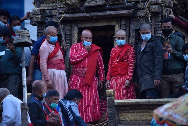 Longest Festival Rato Machindranath Begins During Prohibitory Lockdown In Kathmandu Valley Nepalese Priest arrange to carry idol Rato Machindranath towards the chariot on the first day of the longest chariot festival of Nepal during prohibitory lockdown of covid pandemic in Lalitpur, Nepal on Wednesday, May 12, 2021. Rato Machindranath is also said as the God of Rain and both Hindus and Buddhists worship the Machindranath in hope of good rain to prevent drought during the rice plantation season. Lalitpur NP Nepal maharjan-longestf210512_npgXK  Copyright: xNarayanxMaharjanx