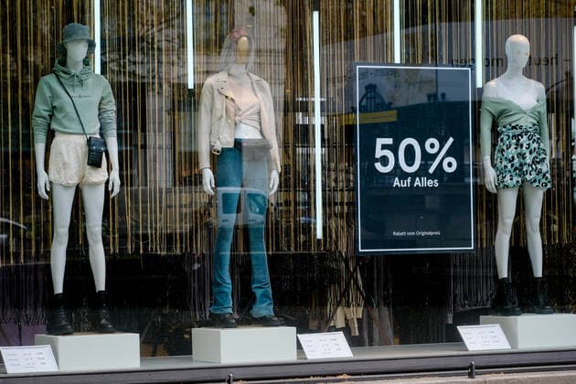 Dusseldorf 12 05 2021 Königsallee shopping mall shopping luxury store pandemic lockdown covid corona mask duty emergency brake shutdown federal emergency brake incidence incidence value shop windows mannequins discount sale mannequins Dusseldorf North Rhine Westphalia Germany