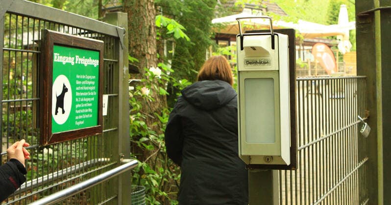 A hand disinfection dispenser in the Schwarze Berge Game Park in Lower Saxony Rose Garden Lower Saxony