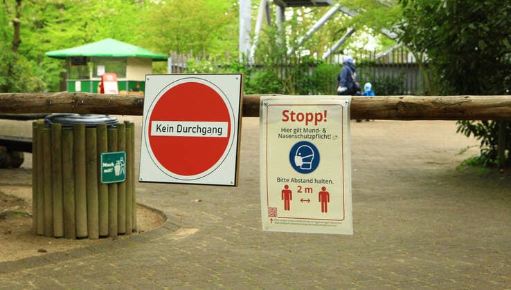A sign in the Schwarze Berge Game Park in Rosengarten, Lower Saxony, informs visitors that the minimum distance of two metres must be observed in this area of the park south of Hamburg Rosengarten Lower Saxony
