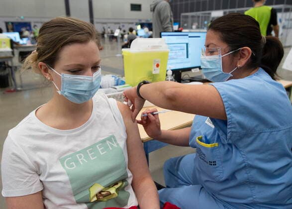 May 13, 2021, Montreal, PQ, Canada: Leonie Nadeau, 29, gets her Pfizer shot at a COVID-19 vaccination clinic, Thursday, May 13, 2021 in Montreal. Montreal Canada  - ZUMAc35_ 20210513_zaf_c35_025 Copyright: xRyanxRemiorzx