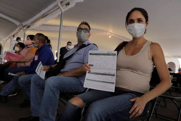 Vaccination Of Pregnant Women Against COVID-19 Begins In Mexico City A pregnant woman inside the facilities of the Benito Juarez Elementary School, located in the Cuauhtemoc district of Mexico City, holds her immunization voucher with the first dose of the Pfizer-BioNTech biologic against COVID-19 during the health emergency and the yellow epidemiological traffic light in the capital. Mexico City Mexico vieyra-notitle210513_npcJ8  Copyright: xGerardoxVieyrax