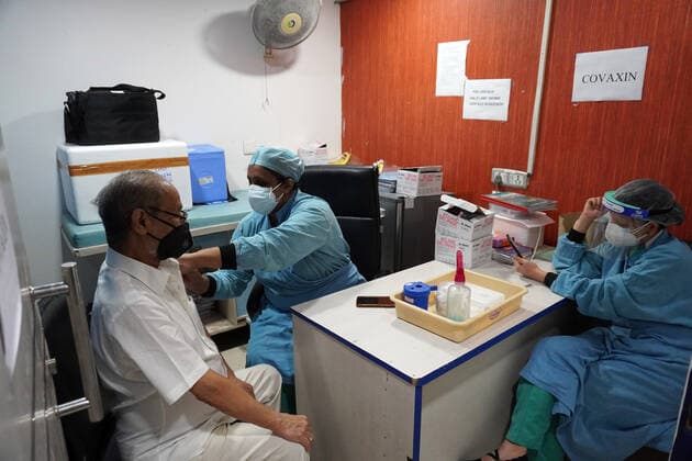 Corona Virus Outbreak In India Babu Lal Verma (76) gets a dose of COVAXIN, a coronavirus (COVID-19) vaccine manufactured by Bharat Biotech, with the assistance of South District Police s COVI-Van initiative, a helpline to help the elderly people struggling with their essential needs, amidst coronavirus (Covid-19) surge, at a vaccination centre in New Delhi, India on May 14, 2021. New Delhi India makhija-notitle210514_np6d2  Copyright: xMayankxMakhijax