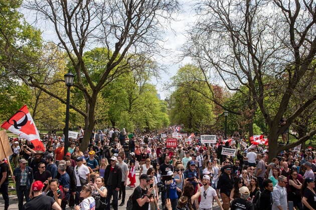 May 15, 2021, Toronto, on, Canada: Protesters march following following a rally to demonstrate against measures taken by government and public health authorities to curb the spread of COVID-19, in Toronto, Saturday, May 15, 2021. Toronto Canada  - ZUMAc35_ 20210515_zaf_c35_044 Copyright: xChrisxYoungx