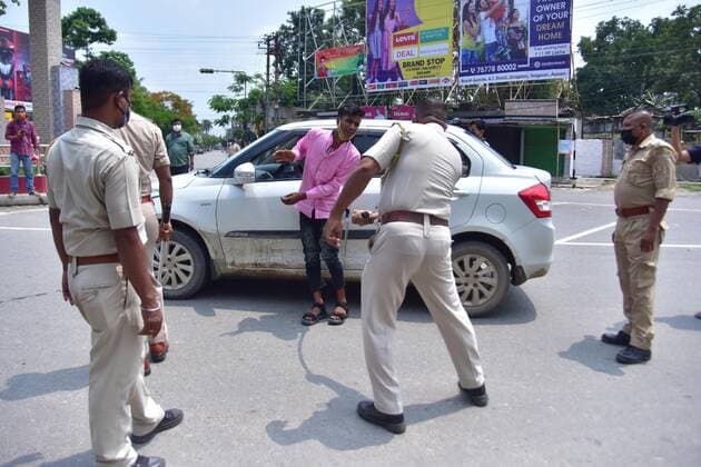 Coronavirus Emergency In India A police officer wields his baton against a man as a punishment for defied curfew due to rise of COVID-19 coronavirus cases in Nagaon District of Assam ,India on May 16,2021. Nagaon India hazarika-notitle210516_npIST  Copyright: xAnuwarxHazarikax
