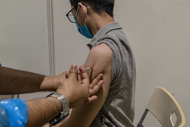 Malaysia s AstraZeneca COVID-19 Vaccination Program A man receives a dose of AstraZeneca COVID-19 vaccine during mass vaccination program in Kuala Lumpur on May 16, 2021. Kuala Lumpur Malaysia latif-notitle210516_npW6D  Copyright: xMohdxFirdausx