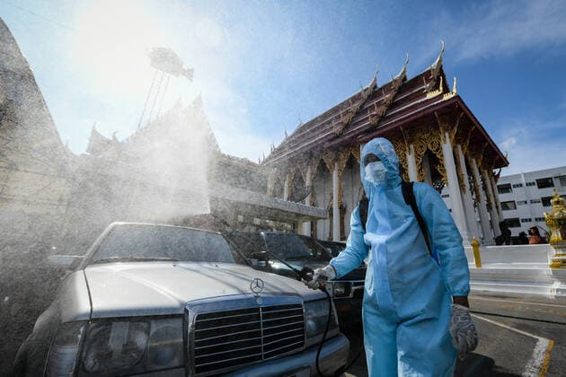 May 16, 2021, Bangkok, Thailand: A rescue worker wearing a Personal Protective Equipment (PPE) disinfects a car at Klong Toey Nok temple in Bangkok..The Public Health Ministry on Sunday reported 24 more Covid-19-related deaths, for a toll of 589 and 2,302 new cases, raising the total to 72,584. Bangkok Thailand - ZUMAs197 20210516_zaa_s197_120 Copyright: xAmpholxThongmueangluangx