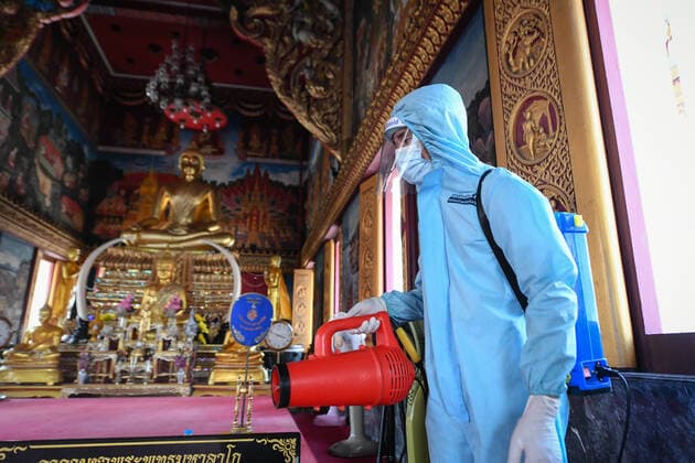 May 16, 2021, Bangkok, Thailand: A rescue worker wearing a Personal Protective Equipment (PPE) sprays a disinfectant at Klong Toey Nok temple in Bangkok..The Public Health Ministry on Sunday reported 24 more Covid-19-related deaths, for a toll of 589 and 2,302 new cases, raising the total to 72,584. Bangkok Thailand - ZUMAs197 20210516_zaa_s197_121 Copyright: xAmpholxThongmueangluangx