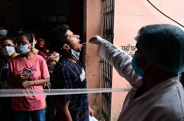 May 17, 2021, Prayagraj, Uttar Pradesh, India: Prayagraj: A medical worker take swab sample for RT-PCR test at Bahariya villageÃ¢â‚¬â ¢s Common Health Centre in Prayagraj on Monday, May 17, 2021. Prayagraj India - ZUMAv115 20210517_zap_v115_001 Copyright: xPrabhatxKumarxVermax