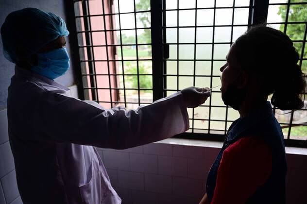 May 17, 2021, Prayagraj, Uttar Pradesh, India: Prayagraj: A medical worker take swab sample at Bahariya village in Prayagraj on Monday, May 17, 2021. Prayagraj India - ZUMAv115 20210517_zap_v115_007 Copyright: xPrabhatxKumarxVermax