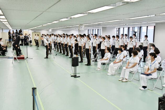 Japan Self?Defense Forces officer salute during a launch ceremony for Japan Self?Defense Forces large-scale Covid-19 vaccination centres in Tokyo, Japan on Monday, May 17, 2021. This centre will open on May 24, 2021. Tokyo operation units organize Ground, Air and Maritime Self?Defense Forces (Army, Air force and Navy) 240 officer and private 110 medical worker out of 350 members.  TKP2021051733 KEIZOxMORI