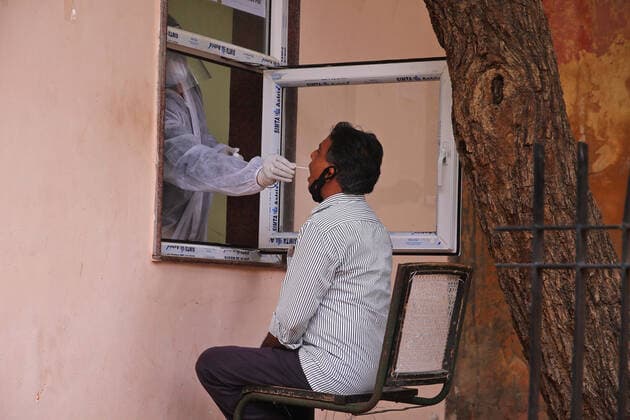 COVID-19 Testing In Jaipur A health worker collects swab sample of a man during the COVID-19 testing, amid in surge of coronavirus cases in Jaipur, Rajasthan, India, Monday, May 17,2021. Jaipur Rajasthan India bhatnagar-notitle210517_np1Sa  Copyright: xVishalxBhatnagarx