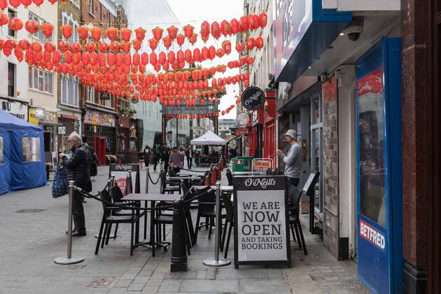 Easing Of Coronavirus Restrictions In London LONDON, UNITED KINGDOM - MAY 17, 2021: A sign reading We are now open is placed outside a pub in Chinatown as England moves to Step 3 in easing of coronavirus restrictions, on 17 May, 2021 in London, England. From today indoor hospitality and entertainment venues are allowed to re-open, six people or two households can meet indoors and international travel without need for quarantine resumes to 12 green list countries, however there are concerns that the surge in cases of the Indian Covid variant may delay the fourth stage of easing lockdown on June 21. London Greater London United Kingdom szymanowicz-easingof210517_npjP0  Copyright: xWIktorxSzymanowiczx