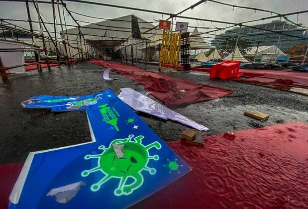 MUMBAI, INDIA - MAY 17: Pandal of BKC Vaccination centre collapsed due to Cyclone Tauktae at BKC on May 17, 2021 in Mumbai, India. The cyclonic storm Tauktae formed over the Arabian Sea, which intensified into a very severe cyclonic storm by Monday morning, caused gusty winds and heavy rains in Mumbai. Strong winds with speed upto 90-100 km hr were recorded across Mumbai and north Konkan.. Several incidents of uprooted trees and collapsed buildings were reported from the city. Thousands of people were evacuated from the coastal region as a precautionary measure. Raigad district is on red alert while Mumbai, Thane and Palghar districts are on orange alert. (Photo by Pratik Chorge Hindustan Times) Cyclone Tauktae Batters Mumbai