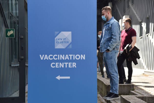 May 17, 2021, Lviv, Ukraine: People stand in line as they wait to enter a vaccination center to have their Covid-19 vaccination done..The city of Lviv in western Ukraine is offering the IT industry workers to be vaccinated with the AstraZeneca Covid-19 vaccine at a vaccination center located at the Arena Lviv stadium. Lviv Ukraine - ZUMAs197 20210517_zaa_s197_321 Copyright: xPavloxPalamarchukx