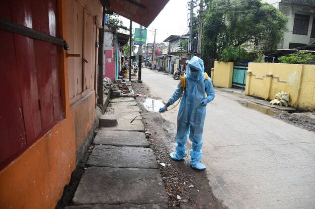 May 17, 2021, Guwahati, Assam, India: A worker spread sanitize on road due to surge in coronavirus in Guwahati Assam India on Monday 17th May 2021 Guwahati India - ZUMAd163 20210517_zip_d163_028 Copyright: xDasarathxDekax
