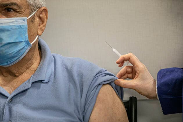 (210517) -- TEHRAN, May 17, 2021 -- A man receives a dose of the COVID-19 vaccine at a vaccination site in Tehran, Iran, on May 17, 2021. Iran reported on Monday 14,319 new COVID-19 cases, raising the country s total number to 2,765,485. By Monday, 2,032,162 people have received the first doses of coronavirus vaccines and 388,821 the second doses. (Photo by Xinhua) IRAN-TEHRAN-COVID-19-VACCINATION AhmadxHalabisaz