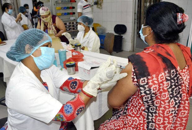 GHAZIABAD, INDIA - MAY 17: A health worker administers a dose of Covid-19 vaccine to a beneficiary, at Sanjay Nagar Hospital, on May 17, 2021 in Ghaziabad, India. (Photo by Sakib Ali Hindustan Times) COVID-19 Vaccination Drive