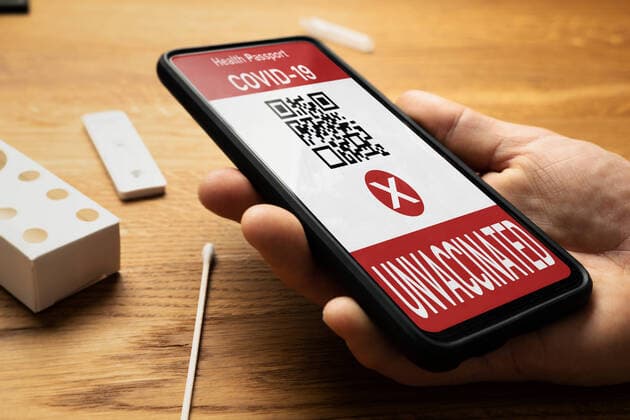 Bavaria, Germany - 18 may 2021: unvaccinated - health certificate with negative result - non immune proof of corona covid-19 vaccination. Smartphone displaying a not imunne digital vaccination certificate. Digitaler Impfpass - ungeimpft