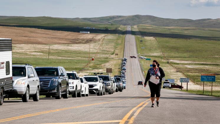 May 18, 2021, Carway, ab, Canada: Catherine Bechard, a CBSA regional Indigenous Affairs advisor, walks along a line-up of southern Alberta residents waiting to get shots of a COVID-19 vaccine from a Montana tribe in Carway, Alta., Tuesday, May 18, 2021. Carway Canada - ZUMAc35_ 20210518_zaf_c35_048 Copyright: xJeffxMcintoshx