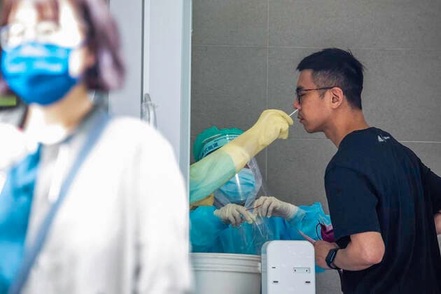 May 19, 2021, New Taipei, Taiwan: A heath worker takes a nasal swab sample from a man during the COVID-19 pandemic..The Taiwanese government is offering free COVID-19 swab testing for its citizens. New Taipei Taiwan - ZUMAs197 20210519_zaa_s197_047 Copyright: xAnnabellexChihx