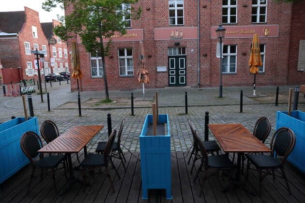 Chairs and tables stand outside La Maison du Chocolat restaurant and cafe in the Dutch Quarter during the lockdown to contain the coronavirus pandemic in Potsdam, Germany, May 19, 2021 Due to stable incidence below 100, outdoor restaurants may open the day after tomorrow Coronavirus outdoor restaurants open in Potsdam, Germany