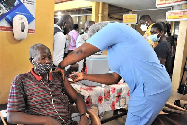 (210520) -- ACCRA, May 20, 2021 -- A medical worker injects a man with a dose of the COVID-19 vaccine at a hospital in Accra, capital of Ghana, May 19, 2021. Ghana on Wednesday commenced phase two of its mass vaccination against COVID-19 in 43 inoculation centers across the country. The health officials are expected to administer a total of 350,000 doses of AstraZeneca vaccines delivered to Ghana through the COVAX facility. (Photo by Xinhua) GHANA-ACCRA-COVID-19-VACCINE Seth 