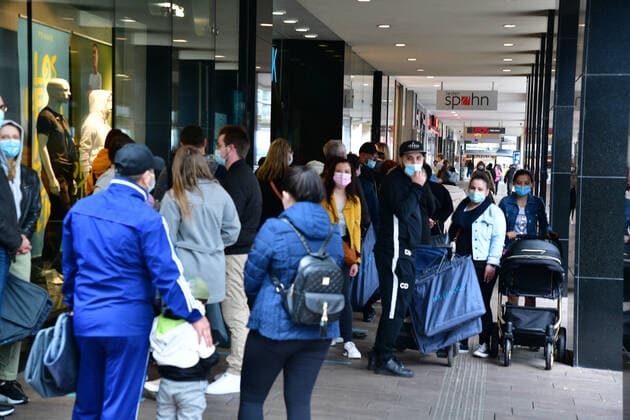 Retail shoppers stand in long queues outside Primark in Saarbrückens Bahnhofstrasse waiting to be let in on Friday 21 5 2021 bub