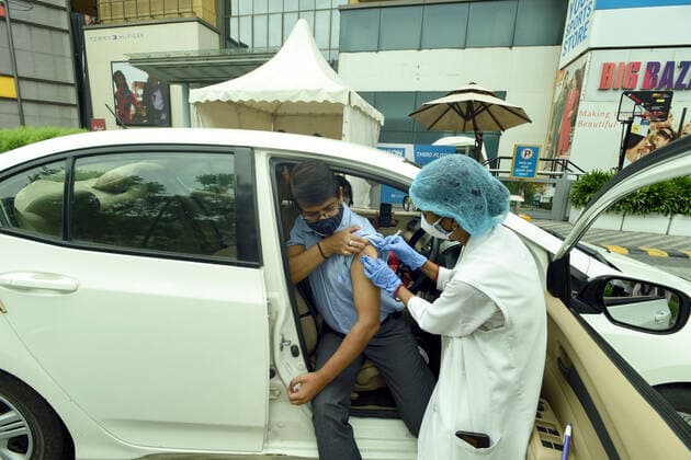 NOIDA, INDIA - MAY 21: A person receives a dose of Covid-19 vaccine at a drive-thru vaccination site set up at the DLF Mall of India on May 21, 2021 in Noida, India. (Photo by Sunil Ghosh Hindustan Times) COVID-19 Vaccination Drive