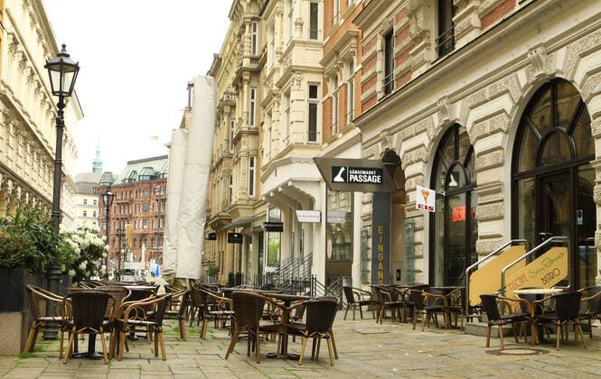 Empty outdoor area of an ice cream parlour in the city centre immediately after opening in Hamburgs filthy weather In Hamburg, the Corona measures have been relaxed due to falling insidence values Retailers and outdoor caterers are allowed to reopen under conditions after more than half a year Old Town Hamburg