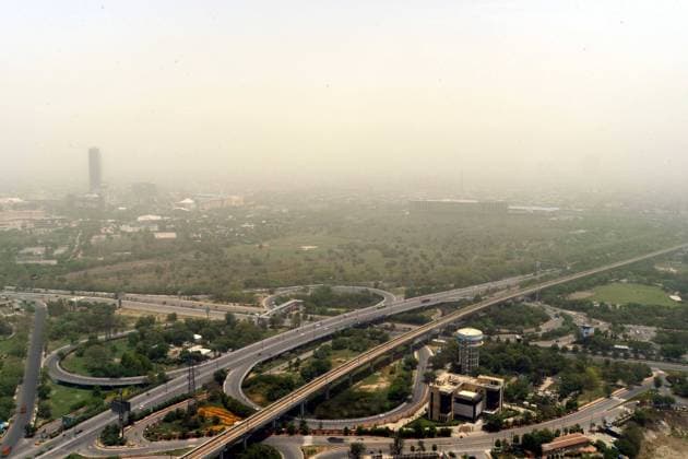 NOIDA, INDIA - MAY 23: A hazy view of the in Noida skyline during a dust storm on May 23, 2021 in Noida, India. Dust shrouds parts of the Delhi NCR since this morning leading to decreased visibility in many areas. Till yesterday, the weather which was clear and open due to rain, has suddenly become dusty in morning today. (Photo by Sunil Ghosh Hindustan Times) Dust Engulfs Parts Of Delhi NCR, Visibility Decreased