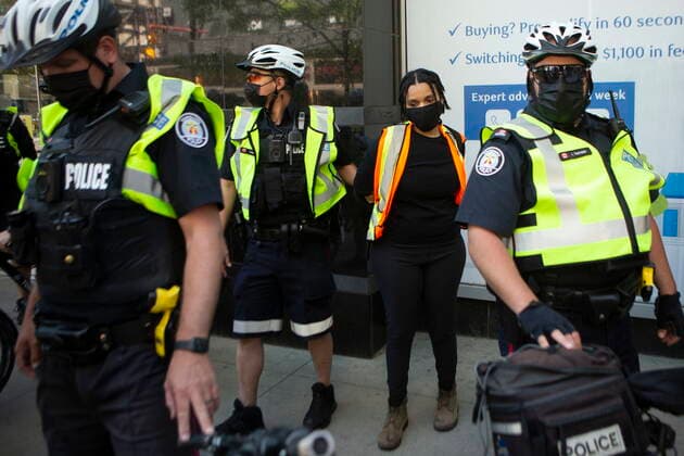 May 24, 2021, Toronto, on, Canada: An organizer is detained by police as demonstrators mark the first anniversary of the death of Regis Korchinski-Paquet, the 29-year-old African Indigenous woman who died in the presence of Toronto police officers, in Toronto on Monday, May 24, 2021. Toronto Canada  - ZUMAc35_ 20210524_zaf_c35_043 Copyright: xChrisxYoungx