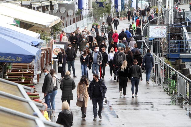 Despite the bad weather, the reopened gastronomy again attracted many people to the banks of the Rhine and the restaurants of the Kasematten on the riverside promenade on the Rhine in Düsseldorf, North Rhine-Westphalia, Germany