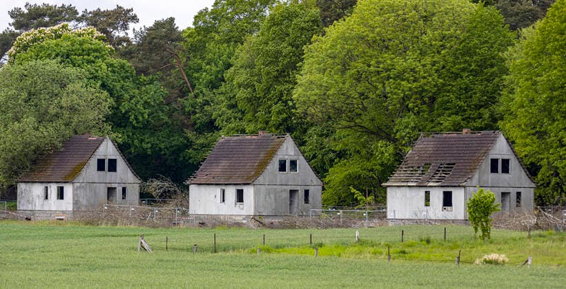 DDR houses with asbestos ruins of DDR houses are not far from Bergen county Vorpommern Ruegen The prefabricated houses were covered with cement boards Bergen Mecklenburg Vorpommern Germany