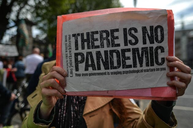 Anti-Vaccination Protest In Dublin A protester holds a placard in front of Leinster House during an anti-vaccination, anti-mask and anti-pandemic protest in the center of Dublin. On Thursday, 27 May 2021, in Dublin, Ireland. Dublin Ireland widak-antivacc210527_npFCL  Copyright: xArturxWidakx