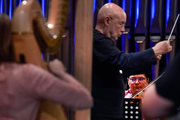 American conductor Dennis Russell Davies, center, and Mexican violist Jose Adolfo Alejo Solis, right, perform with Brno Philharmonic during a dress rehearsal for the opening concert of the Leos Janacek International Music Festival in Ostrava, Czech Republic, May 27, 2021. (CTKxPhoto JaroslavxOzana) CTKPhotoP2021052708417  JAO 01