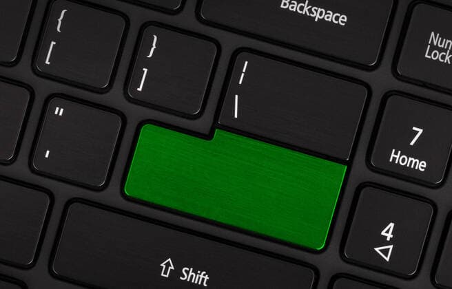 Laptop computer keyboard with blank green button for text Copyright: xMichaxKlootwijkx 21971426
