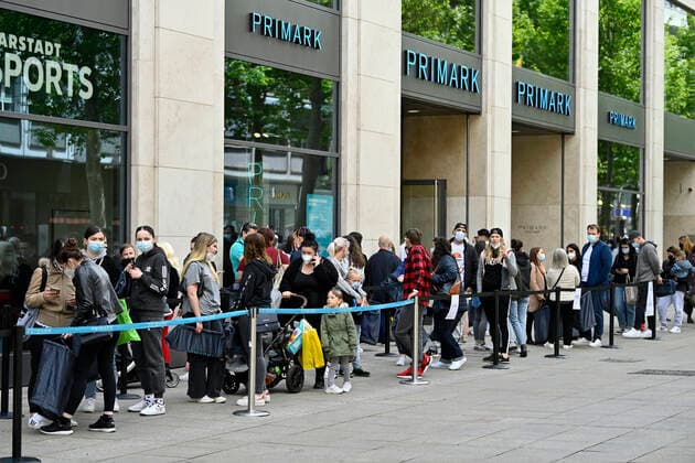 Customers queue outside Primark, click meet shopping with QR code, digital contact tracking in retail, Corona crisis, Stuttgart, Baden Württemberg, Germany Coronavirus
