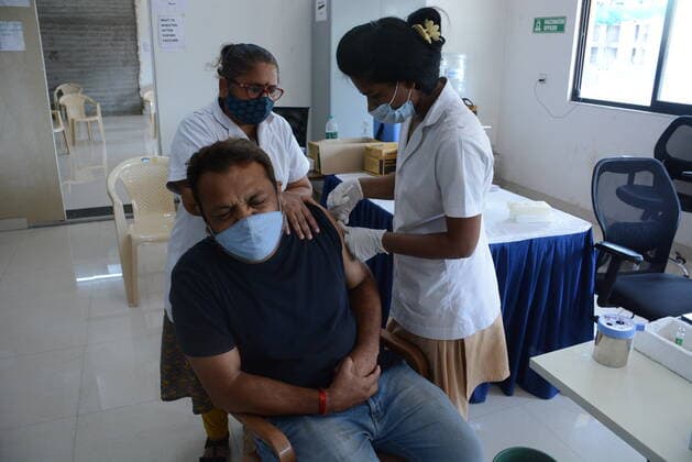 MUMBAI, INDIA - MAY 28: Senior citizens and beneficiaries in the above 45 age group get vaccinated against Covid-19 at TMC s vaccination centre at Majiwada, in Thane, on May 28, 2021 in Mumbai, India. (Photo by Praful Gangurde Hindustan Times ) COVID-19 Vaccination Drive