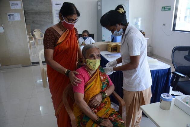 MUMBAI, INDIA - MAY 28: Senior citizens and beneficiaries in the above 45 age group get vaccinated against Covid-19 at TMC s vaccination centre at Majiwada, in Thane, on May 28, 2021 in Mumbai, India. (Photo by Praful Gangurde Hindustan Times ) COVID-19 Vaccination Drive