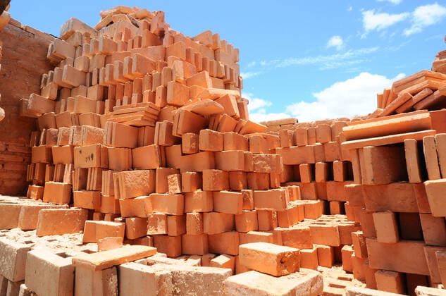Production Of Clay Blocks In Mexico QUERETARO, MEXICO MAY 28: A worker is seen during the production of clay partitions, handmade with a clay material with which he shapes partitions, tiles and other different shapes, that will be used for the construction of houses. mud or yellow brick is the most common for the construction of buildings and houses in Mexico. On May 28, 2021 in Queretaro, Mexico. Copyright: xCarlosxTischlerx EYEPIXGROUP_CT_28052021_7851