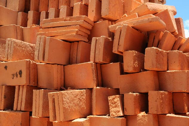 Production Of Clay Blocks In Mexico QUERETARO, MEXICO MAY 28: A worker is seen during the production of clay partitions, handmade with a clay material with which he shapes partitions, tiles and other different shapes, that will be used for the construction of houses. mud or yellow brick is the most common for the construction of buildings and houses in Mexico. On May 28, 2021 in Queretaro, Mexico. Copyright: xCarlosxTischlerx EYEPIXGROUP_CT_28052021_7852