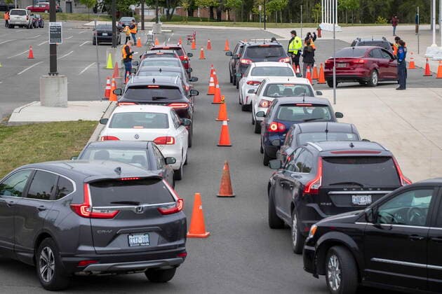 May 28, 2021, Kingston, Ontario, Canada: Vehicles wait in a line up during a COVID-19 vaccine drive-thru clinic at Richardson Stadium in Kingston, Ont., on Friday, May 28, 2021. Kingston Canada  - ZUMAc35_ 20210528_zaf_c35_046 Copyright: xLarsxHagbergx
