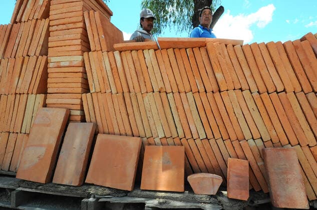 Production Of Clay Blocks In Mexico A worker is seen during the production of clay partitions, handmade with a clay material with which he shapes partitions, tiles and other different shapes, that will be used for the construction of houses. mud or yellow brick is the most common for the construction of buildings and houses in Mexico. On May 28, 2021 in Queretaro, Mexico. Mexico City Mexico group-producti210528_npfJT  Copyright: xEyepixx