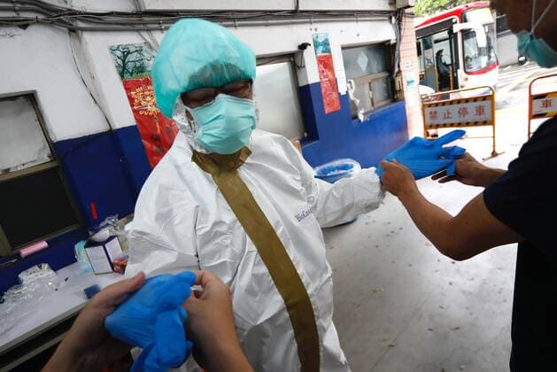 May 29, 2021, Taipei, Taipei, Taiwan: A special quarantine bus driver puts on a PPE at a fire station, where buses and taxis that carried quarantined persons are spread with disinfectant, before delivering citizens who have completed their quarantine, following a surge of domestic COVID-19 cases. The number of domestic COVID-19 cases particularly in Taipei has surged, with disinfection being intensified across the country to minimize transmission. Taipei Taiwan - ZUMAs313 20210529_zip_s313_022 Copyright: xDanielxCengxShou-Yix