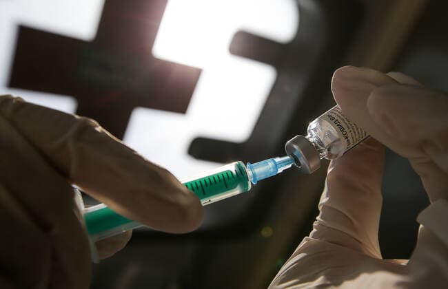 TATARSTAN, RUSSIA - MAY 29, 2021: A nurse draws up a dose of the Gam-COVID-Vac (Sputnik V) vaccine against COVID-19 into a syringe to administer a Component 1 injection in a mobile health unit on the premises of the Volga gardening partnership. Yegor Aleyev TASS  TS102040