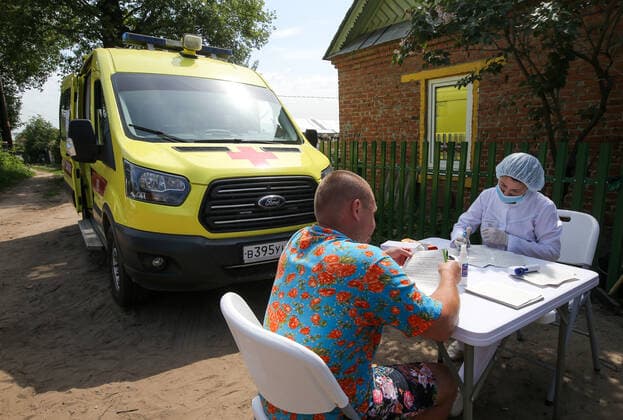 TATARSTAN, RUSSIA - MAY 29, 2021: A man visits a mobile health unit to receive an injection of the Gam-COVID-Vac (Sputnik V) vaccine against COVID-19 on the premises of the Volga gardening partnership. Yegor Aleyev TASS  TS102048